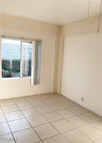 a view of an empty room and window