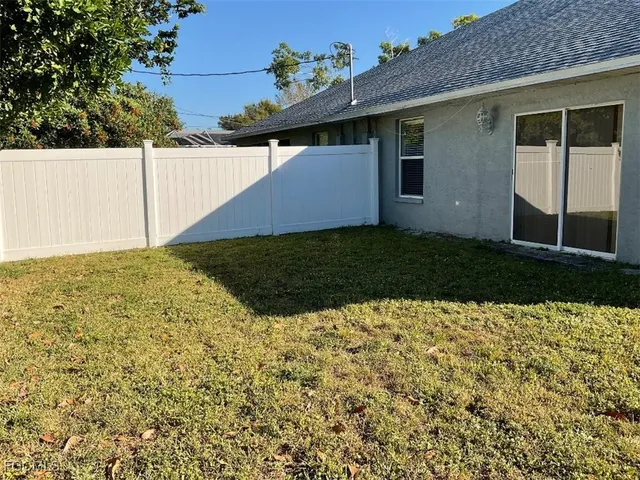 a view of yard with large trees