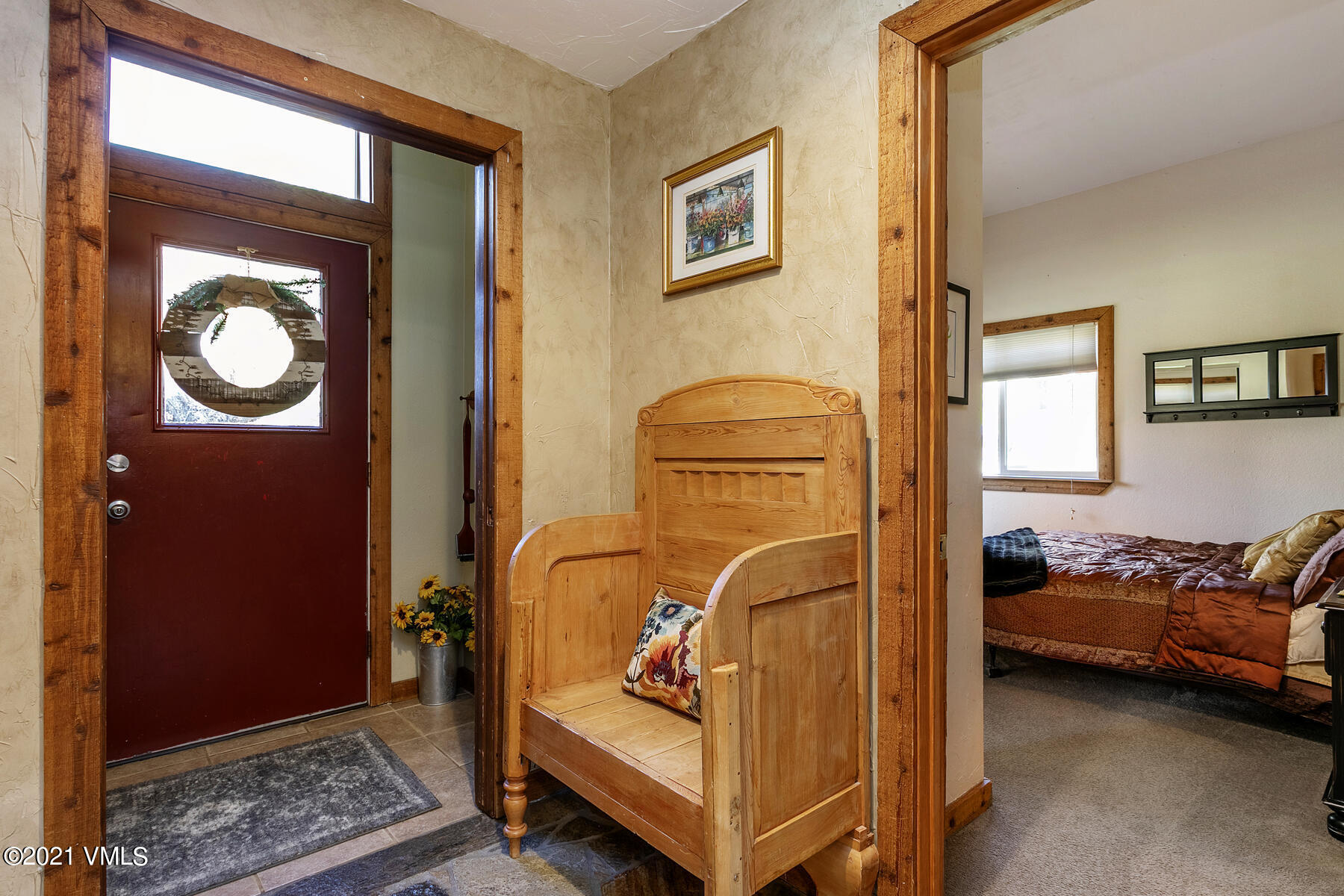 31 Beaver Road, Unit B Avon, CO 81620 - Photo 15 of 34 a bedroom with a bed and the view of mirror