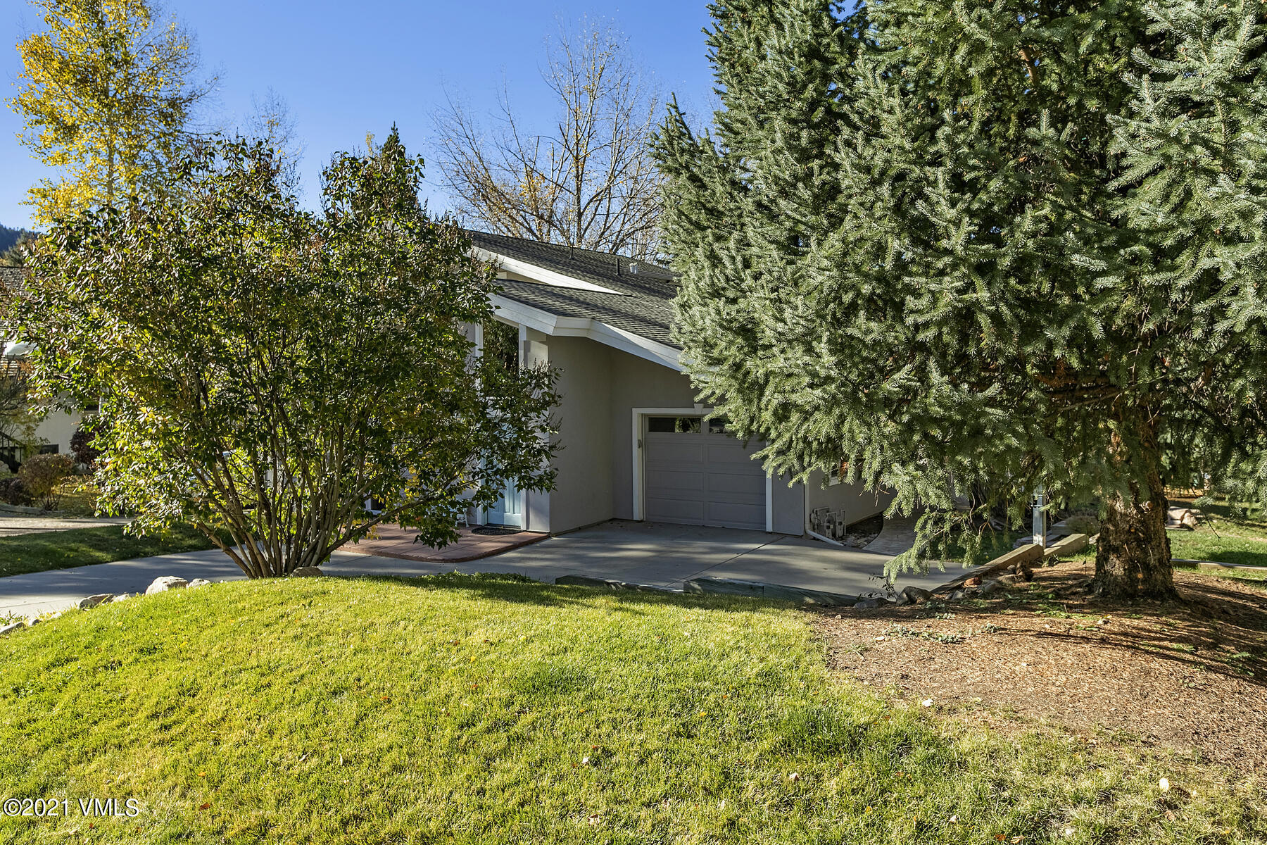 31 Beaver Road, Unit B Avon, CO 81620 - Photo 2 of 34 a view of backyard of house with green space