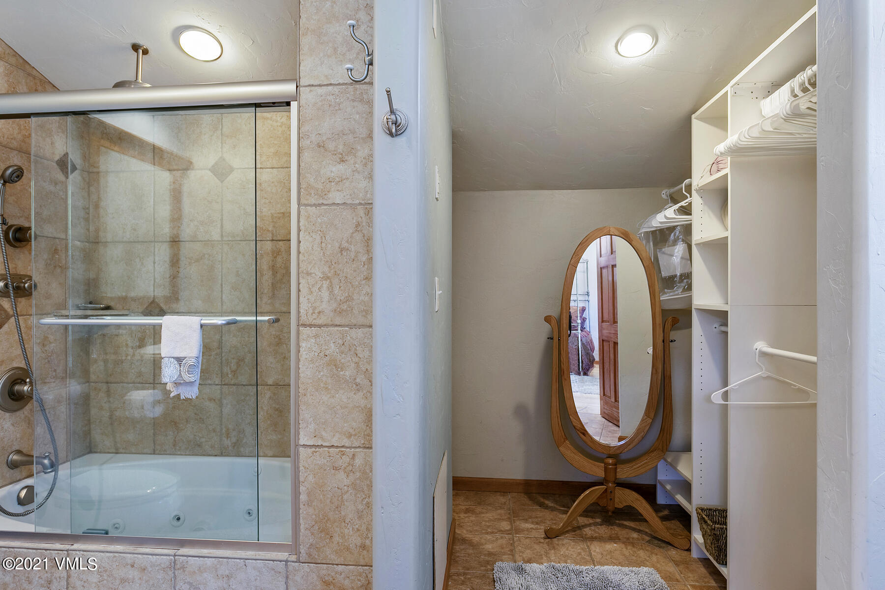 31 Beaver Road, Unit B Avon, CO 81620 - Photo 22 of 34 a bathroom with a mirror and a shower
