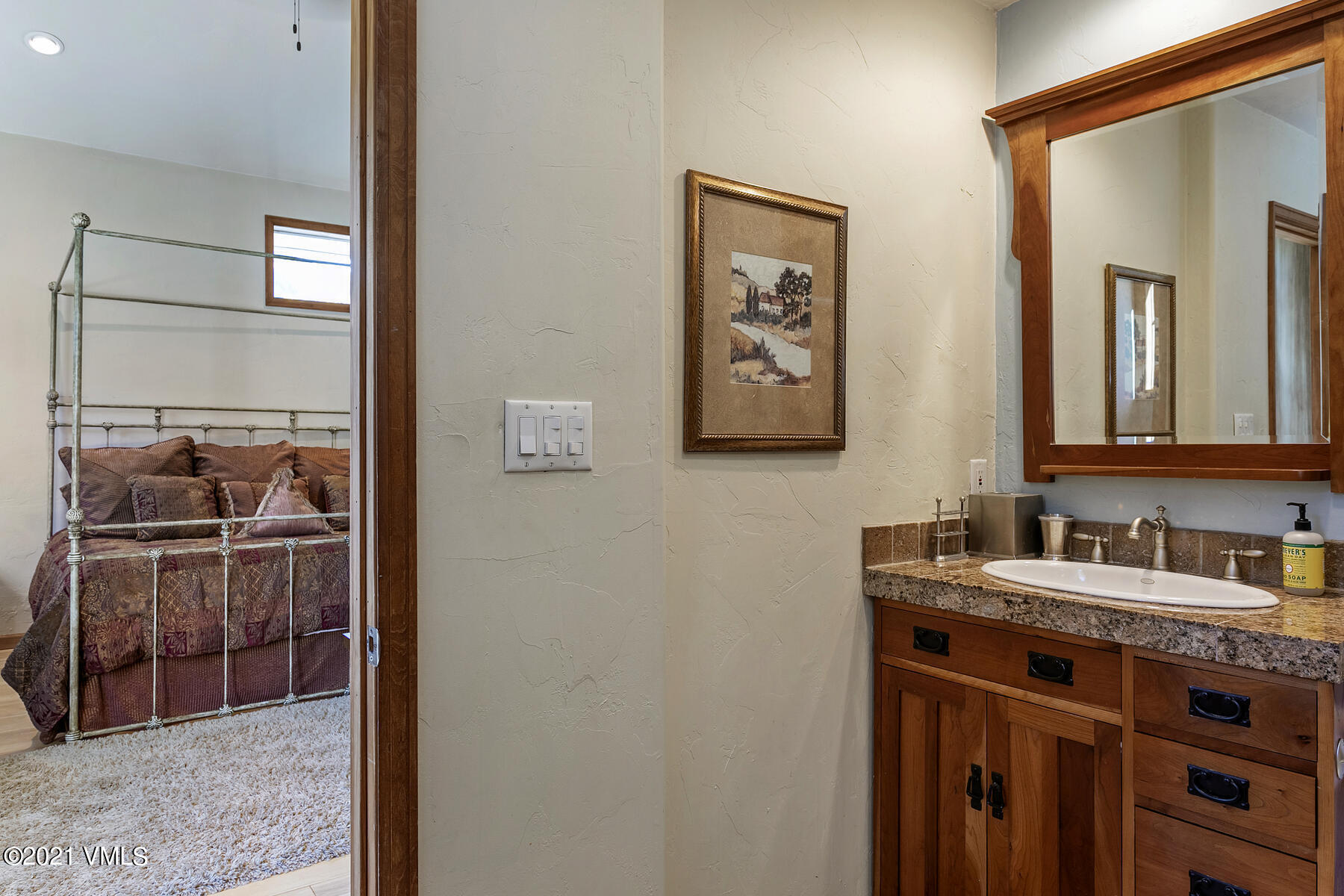 31 Beaver Road, Unit B Avon, CO 81620 - Photo 24 of 34 a bathroom with a sink and a mirror