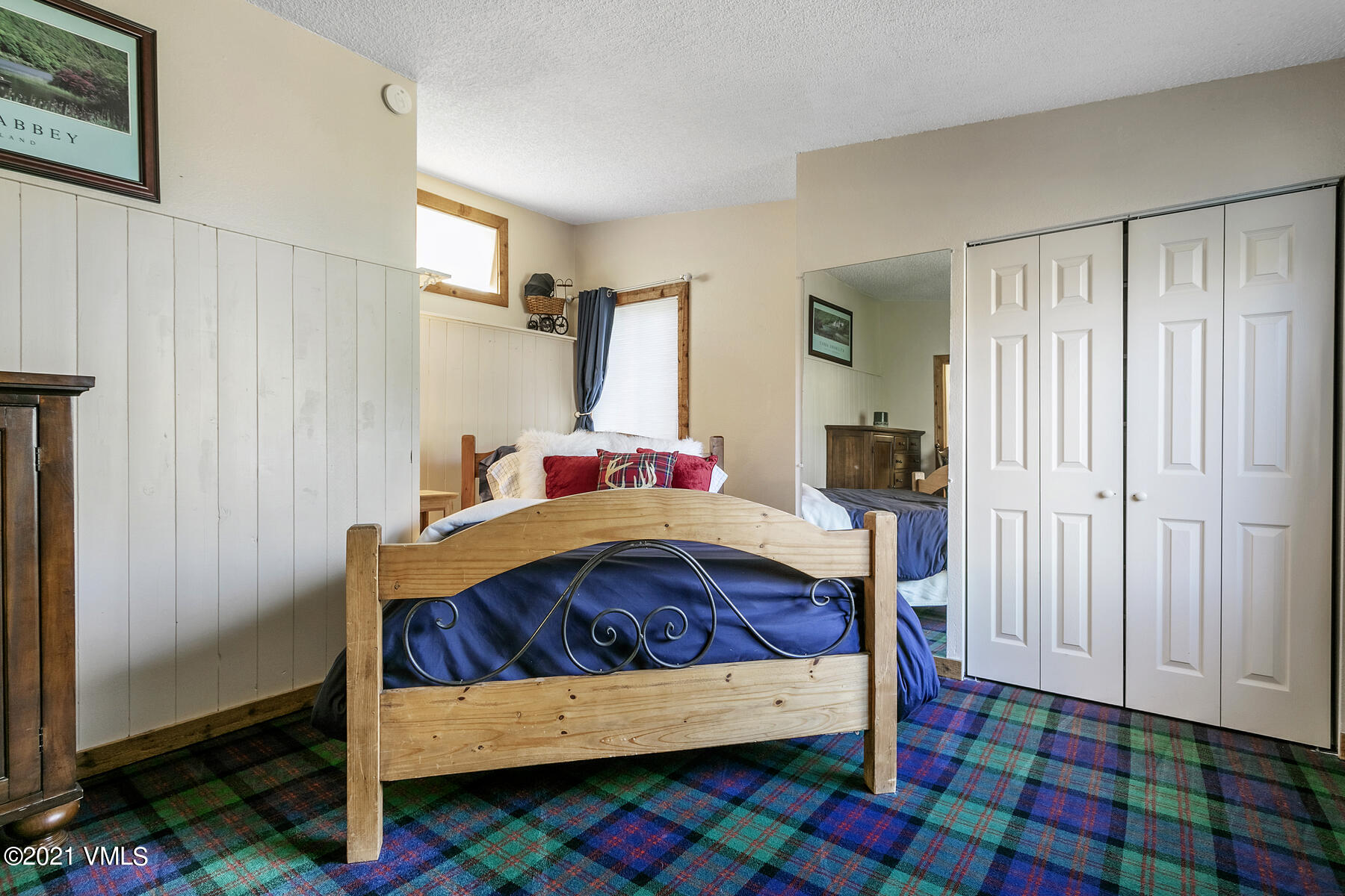 31 Beaver Road, Unit B Avon, CO 81620 - Photo 25 of 34 a bedroom with a bed and a window