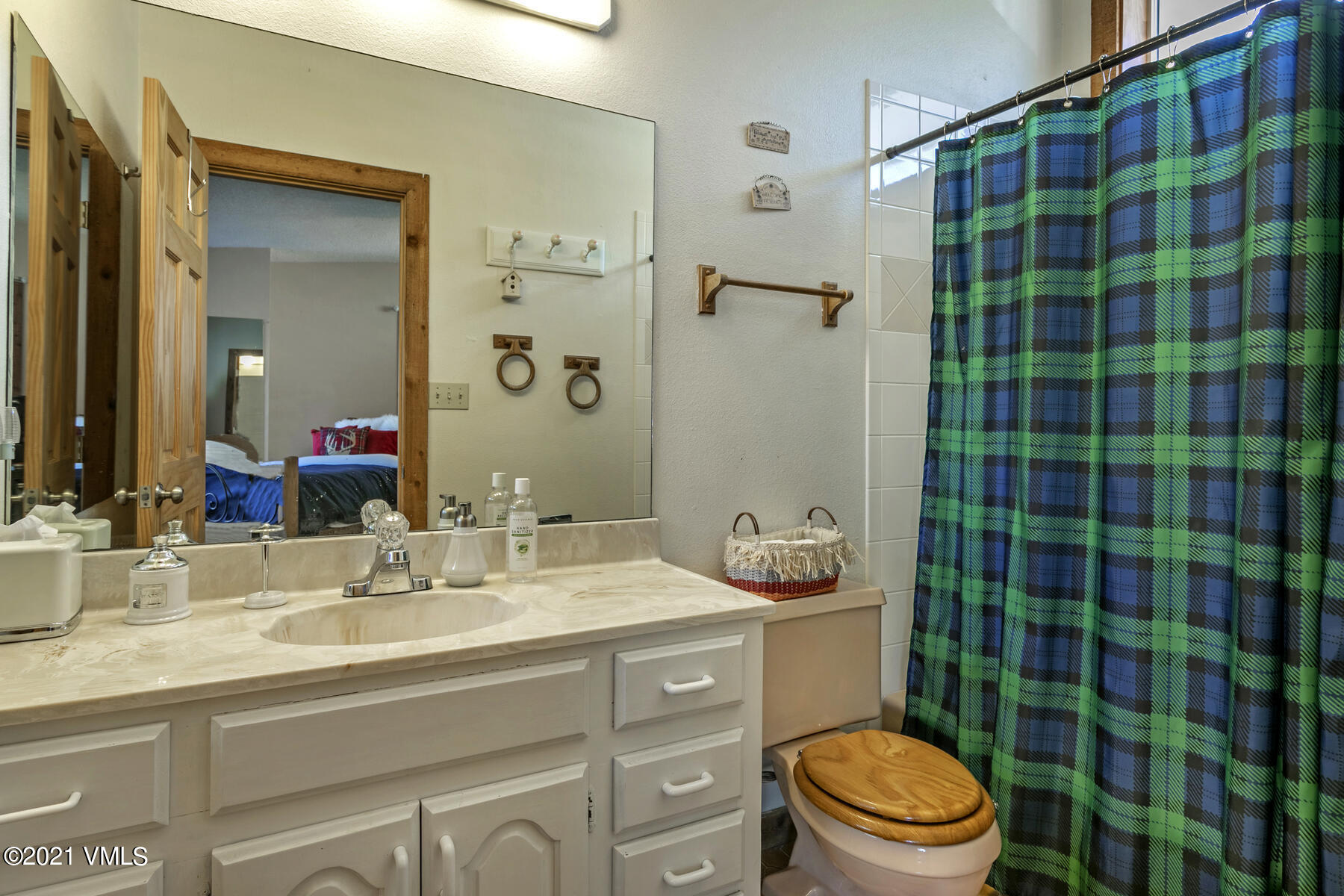 31 Beaver Road, Unit B Avon, CO 81620 - Photo 27 of 34 a bathroom with a sink a toilet a shower and a mirror