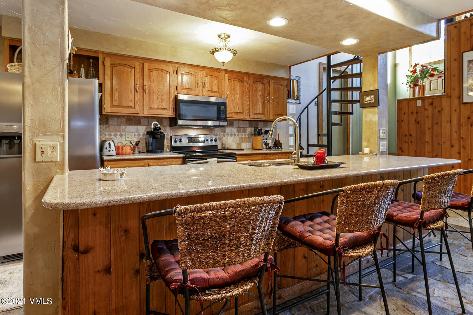 31 Beaver Road, Unit B Avon, CO 81620 - Photo 5 of 34 a kitchen with stainless steel appliances a sink and a refrigerator