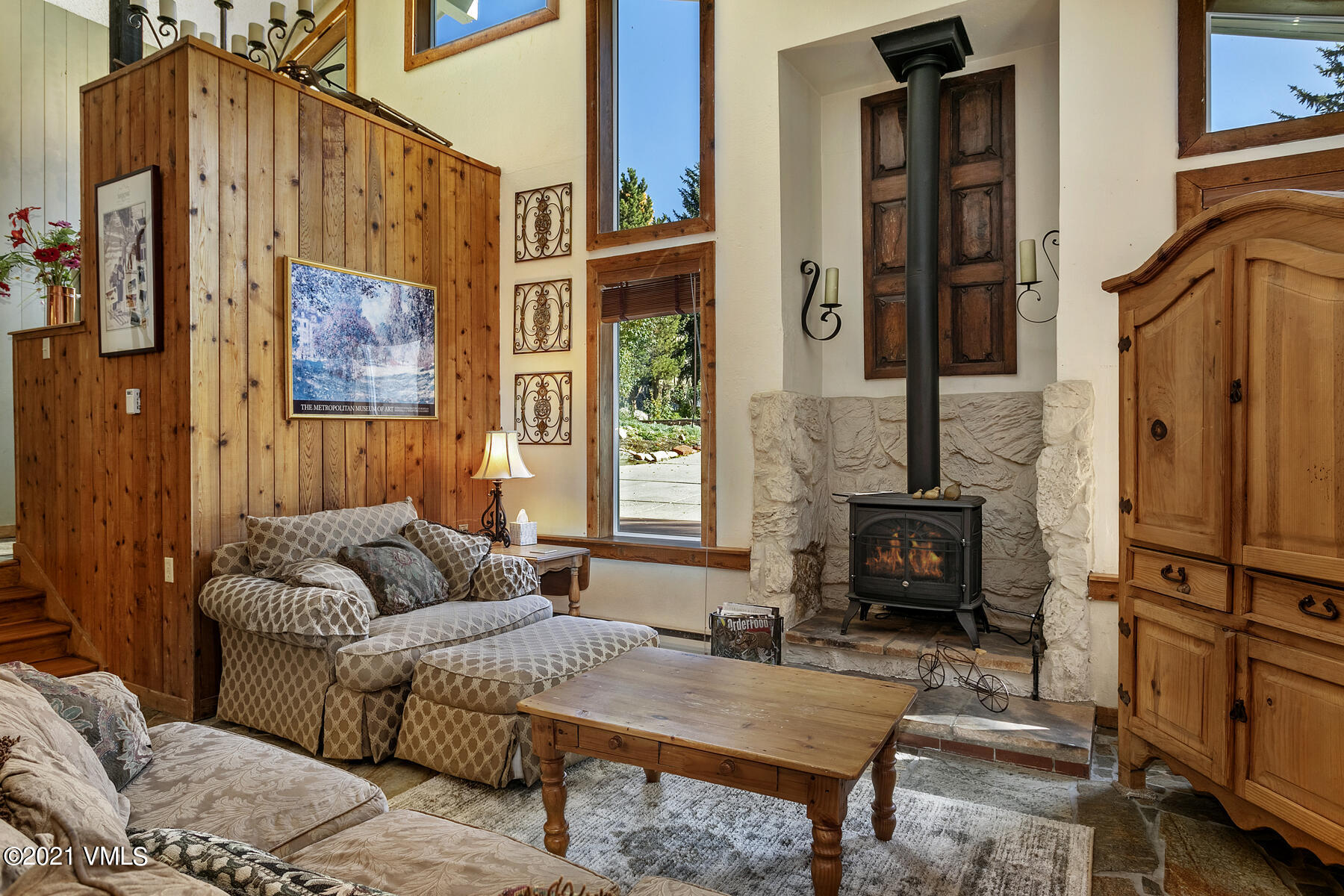 31 Beaver Road, Unit B Avon, CO 81620 - Photo 10 of 34 a living room with furniture a fireplace and a flat screen tv