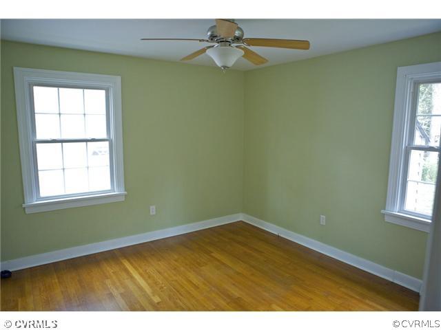 9103 Peaks Road Ashland, VA 23005 - Photo 7 of 12 an empty room with a window and a ceiling fan