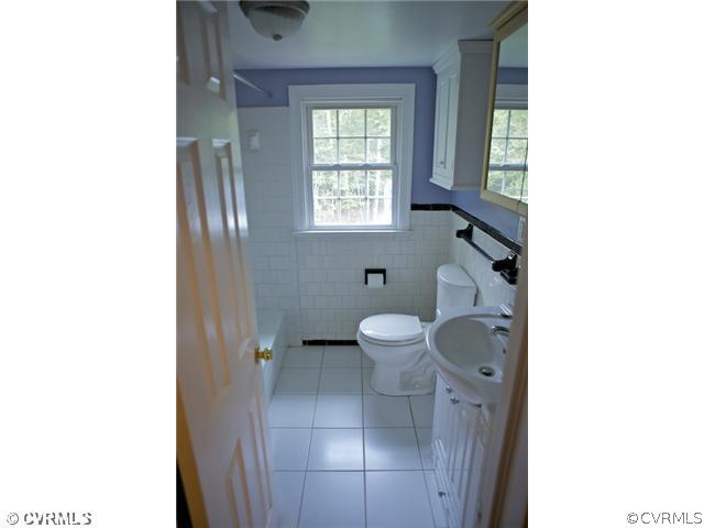 9103 Peaks Road Ashland, VA 23005 - Photo 10 of 12 a bathroom with a toilet sink and window