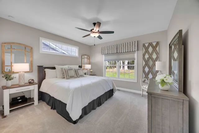 a bathroom with a double vanity sink mirror and shower