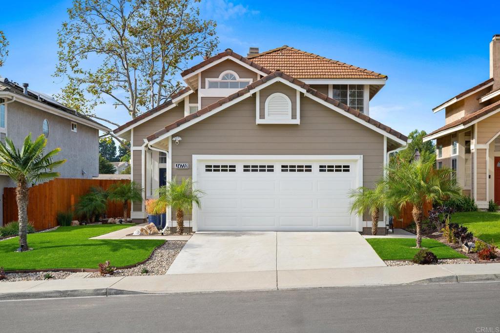 14710 Carmel Ridge Road San Diego, CA 92128 - Photo 1 of 1 front view of house with a yard