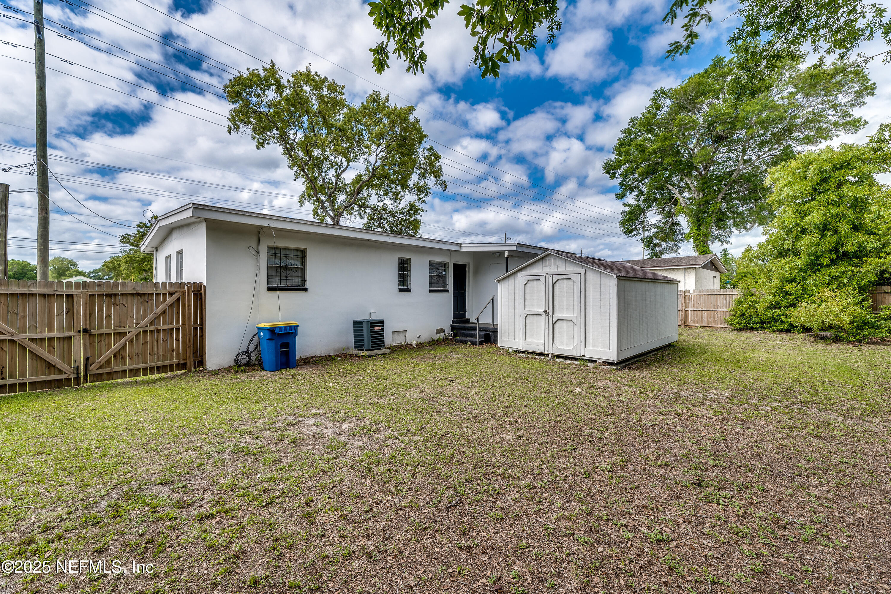 7419 Merrill Road Jacksonville, FL 32277 - Photo 4 of 12 a house with a outdoor space