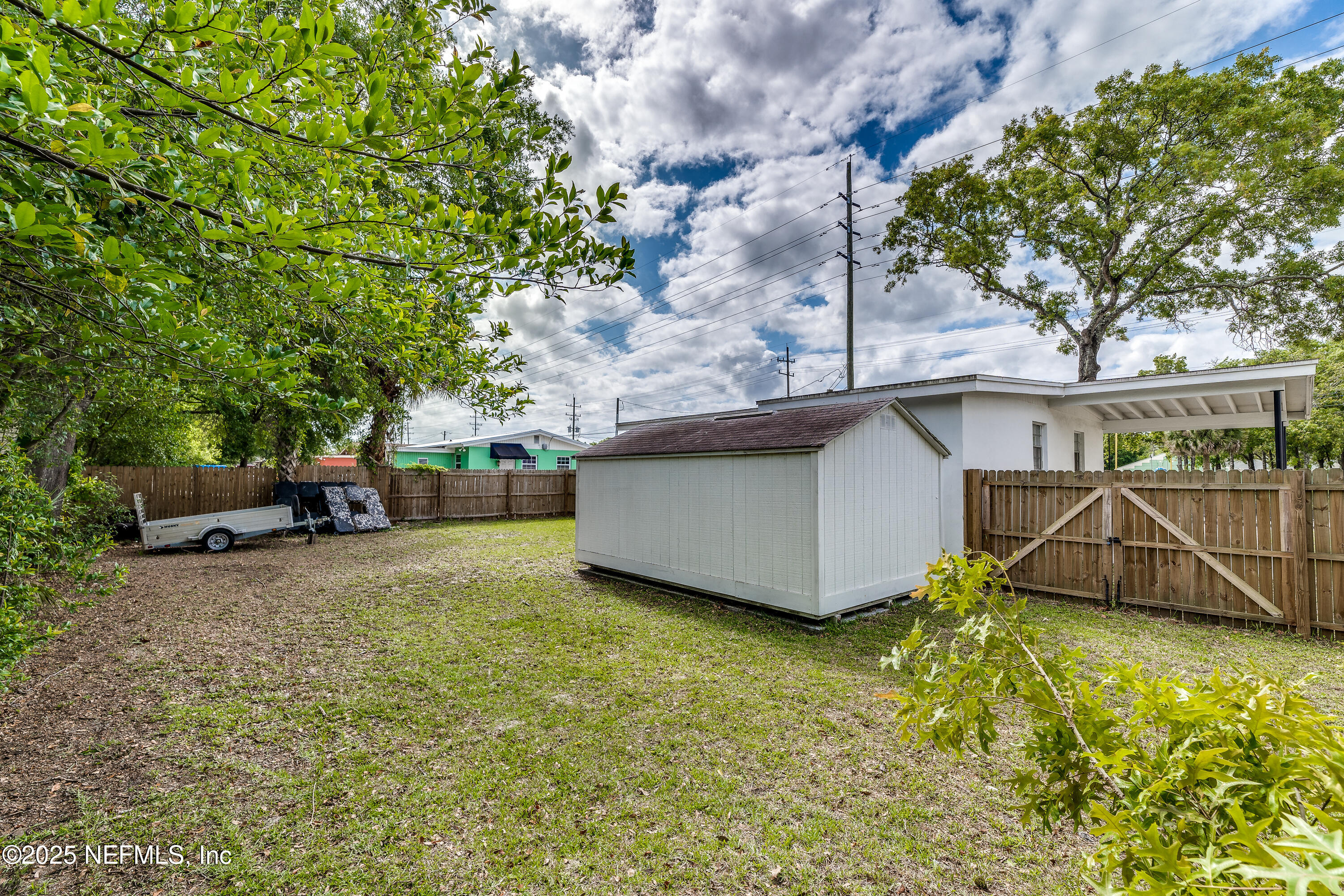7419 Merrill Road Jacksonville, FL 32277 - Photo 5 of 12 a view of a backyard with swimming pool