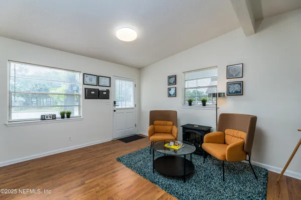 a living room with furniture and a window