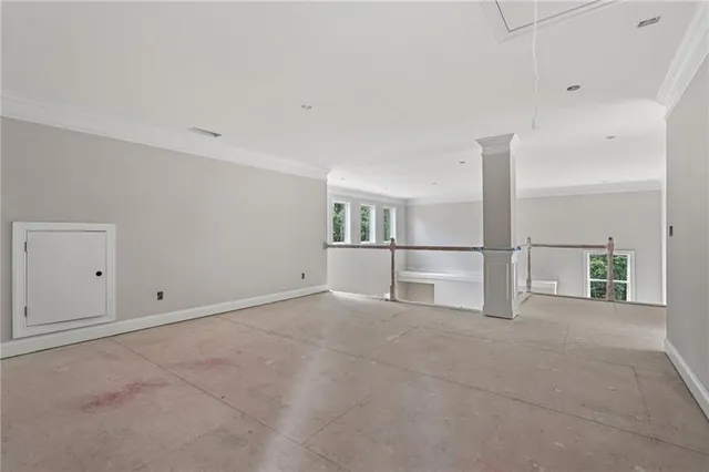 a view of a garden with a house in the background