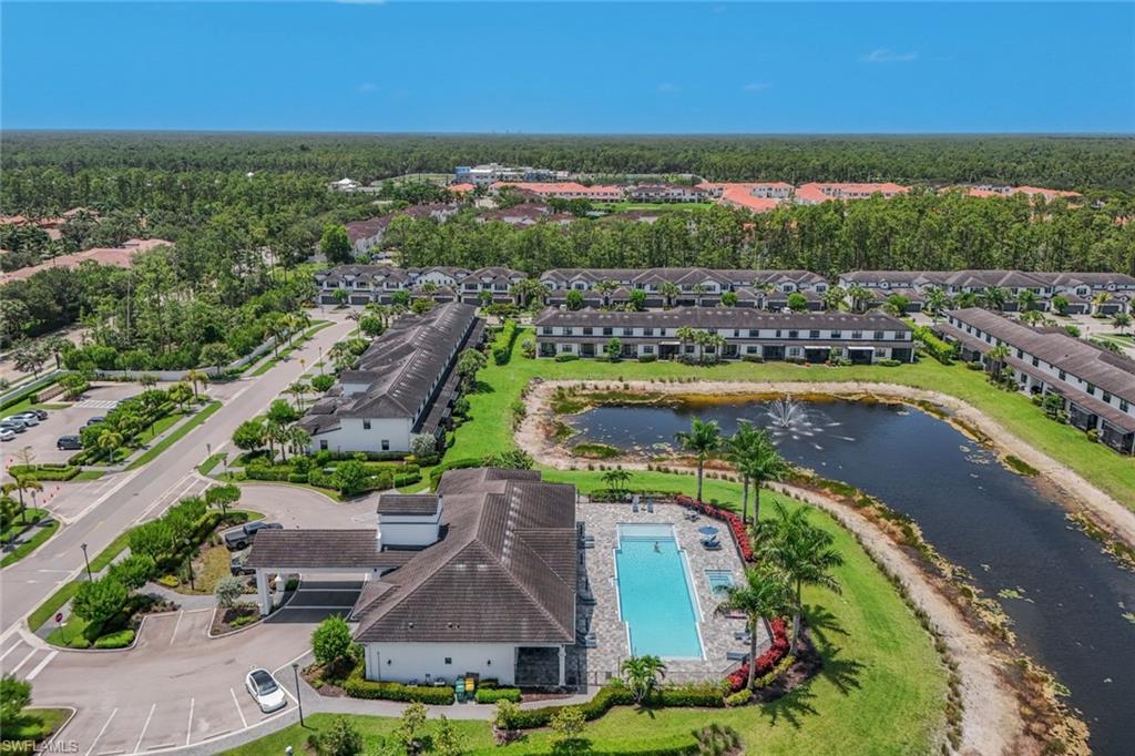 7348 Rockefeller Drive Naples, FL 34119 - Photo 38 of 39 Clubhouse, Community Pool, & Surrounding Area