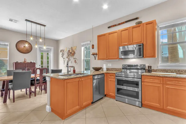 a view of a dining room with furniture and window