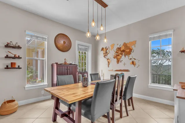 a dining room with furniture a rug and wooden floor