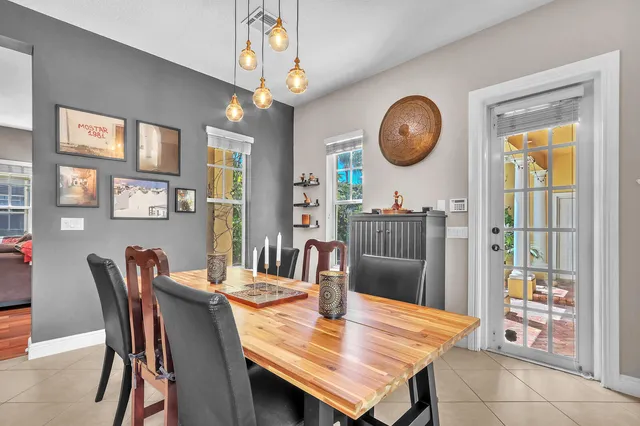 a living room with furniture and a book shelf