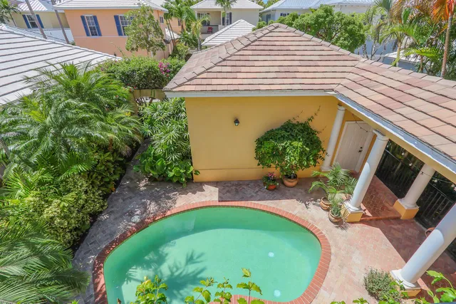 a living room with furniture and a bookshelf