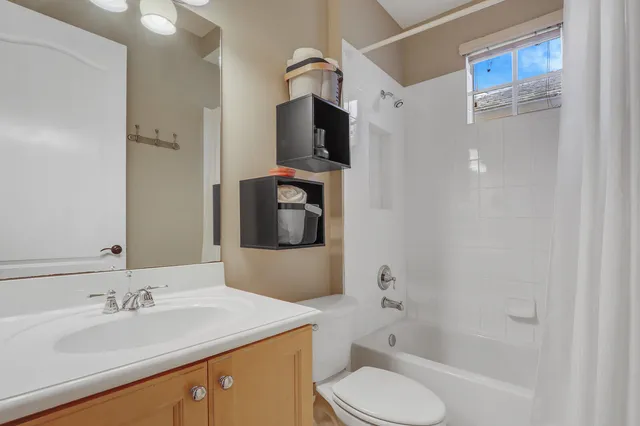 a view of a backyard with plants and porch