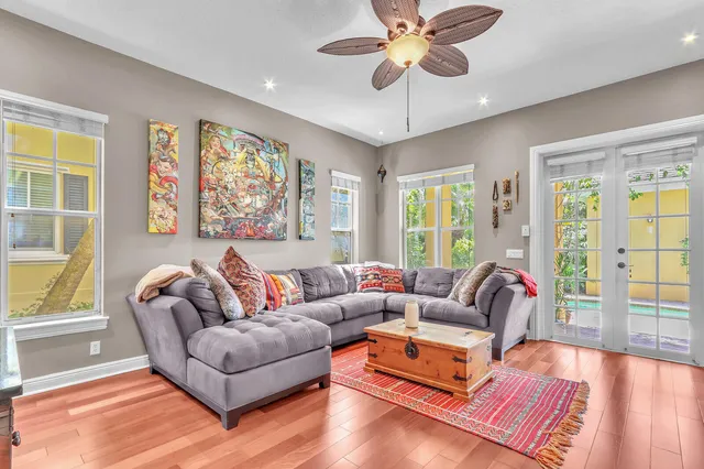 a living room with furniture a fireplace and a flat screen tv