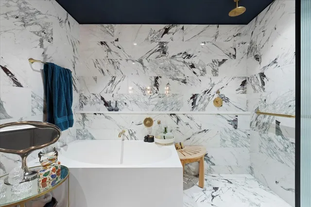 a bathroom with a bathtub and a sink