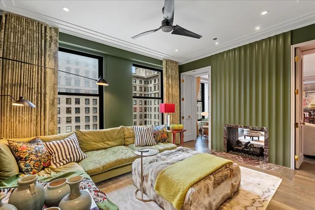 a bedroom with a bed couch and a window