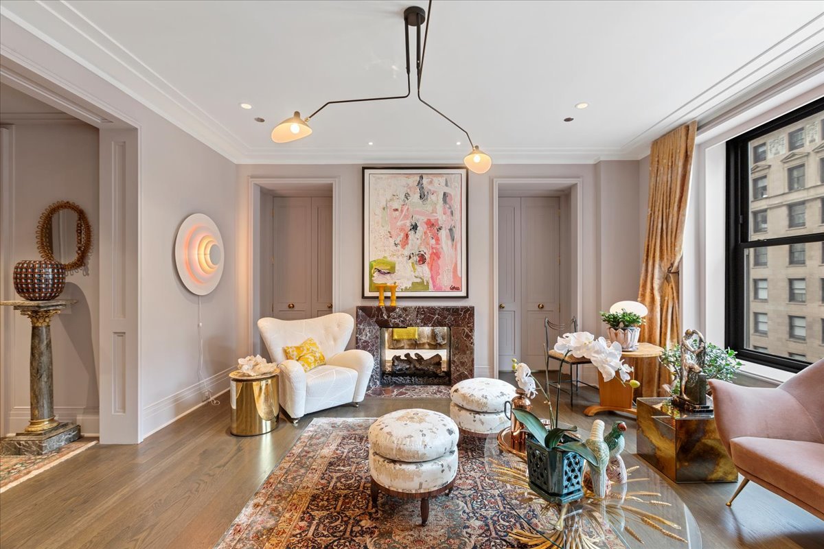 159 East Walton Place, Unit 8C Chicago, IL 60611 - Photo 3 of 28 a living room with fireplace furniture and a large window