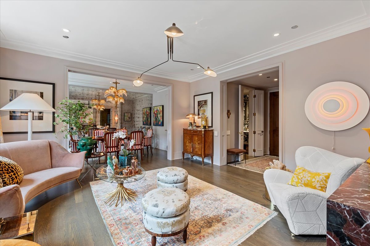 159 East Walton Place, Unit 8C Chicago, IL 60611 - Photo 4 of 28 a living room with furniture and a chandelier