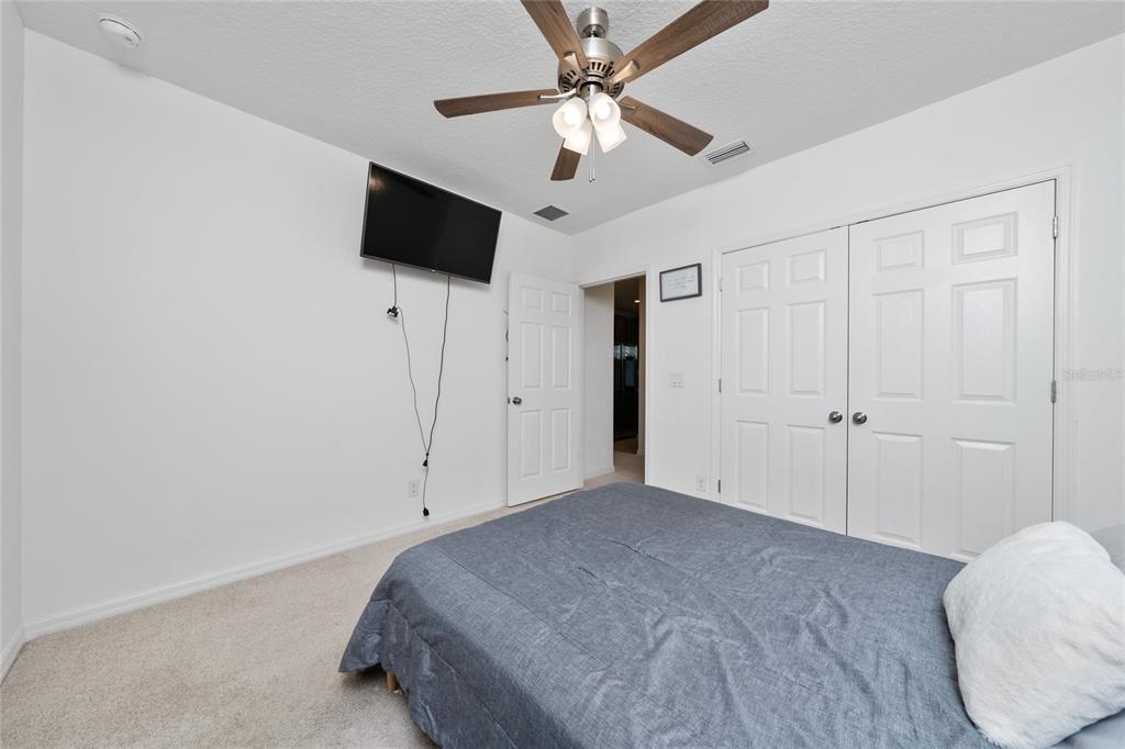 669 Jupiter Beach Road Groveland, FL 34736 - Photo 15 of 41 a view of a livingroom with a ceiling fan and window