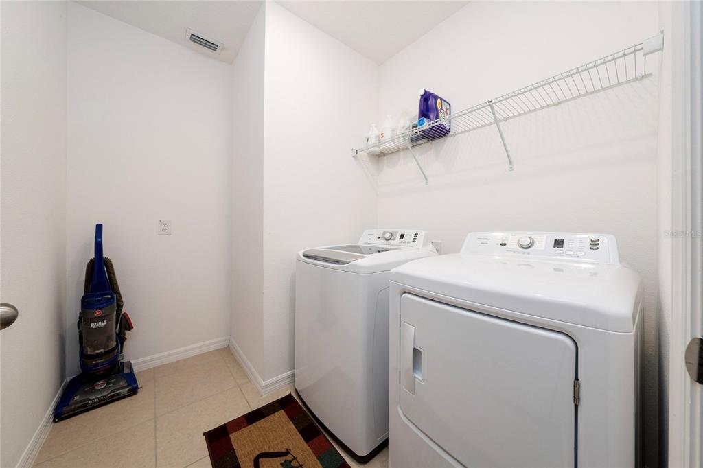 669 Jupiter Beach Road Groveland, FL 34736 - Photo 21 of 41 a utility room with dryer and washer