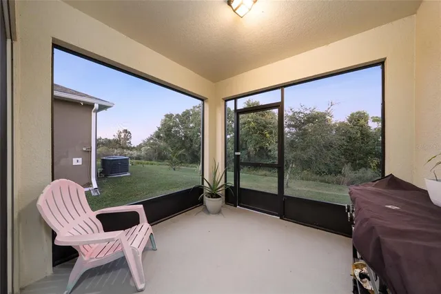 a view of a balcony with chairs and a table