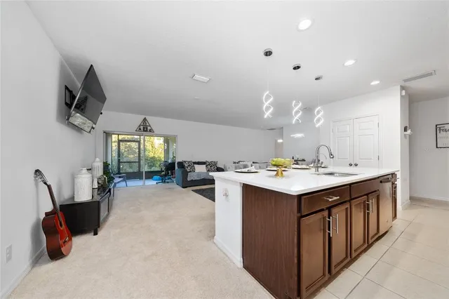 a kitchen with a sink a counter top space and appliances