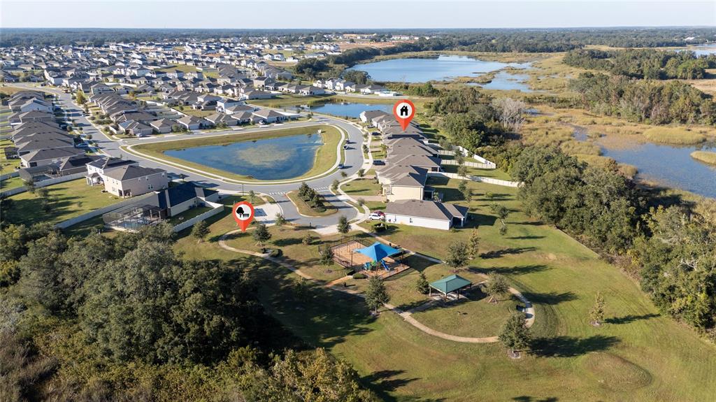 669 Jupiter Beach Road Groveland, FL 34736 - Photo 32 of 41 an aerial view of a houses with outdoor space