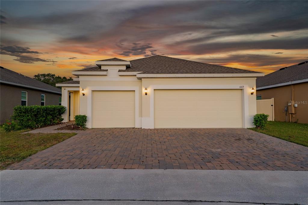 669 Jupiter Beach Road Groveland, FL 34736 - Photo 40 of 41 a view of a house with a yard