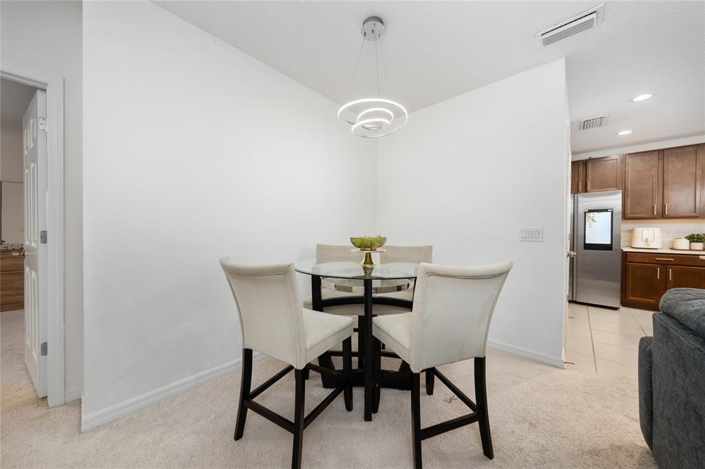 669 Jupiter Beach Road Groveland, FL 34736 - Photo 7 of 41 a view of a dining room with furniture