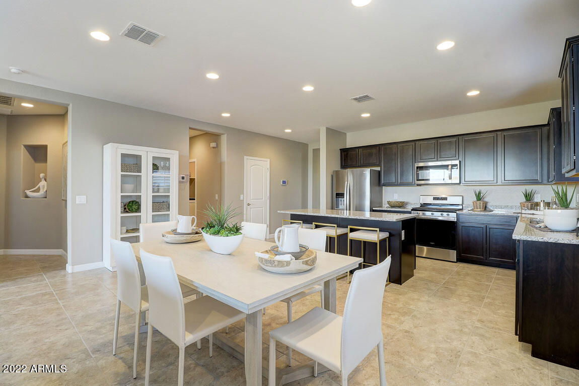 44401 West Palo Olmo Road Maricopa, AZ 85138 - Photo 3 of 48 McCormick Kitchen Dining Area 2