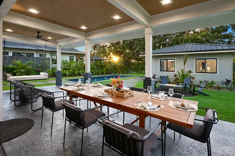 a outdoor dining space with furniture and garden view