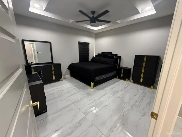 a kitchen with stainless steel appliances kitchen island granite countertop a refrigerator and a stove