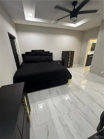 a bedroom with a bed and a dresser