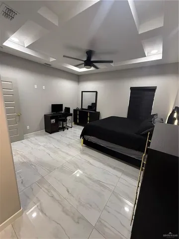 a bedroom with double bed and a lamp