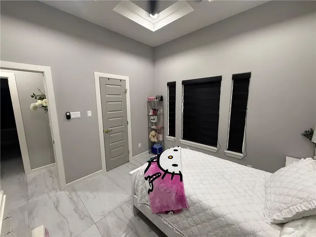 a room with furniture and a flat screen tv