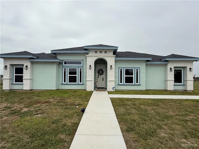 front view of a house with a yard