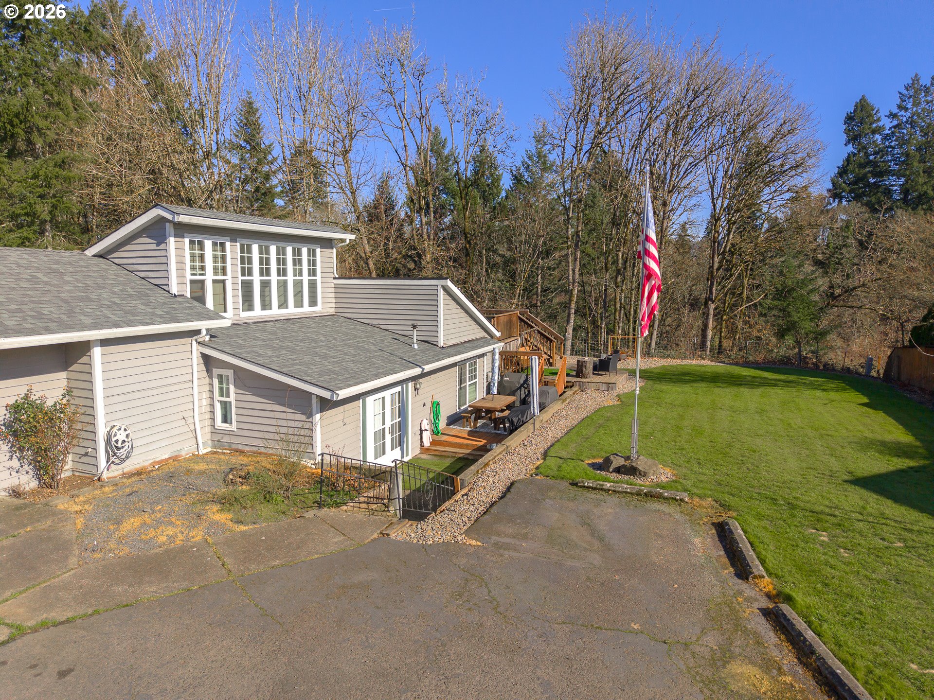 600 Wynooski Street Newberg, OR 97132 - Photo 12 of 48 a house with trees in front of it