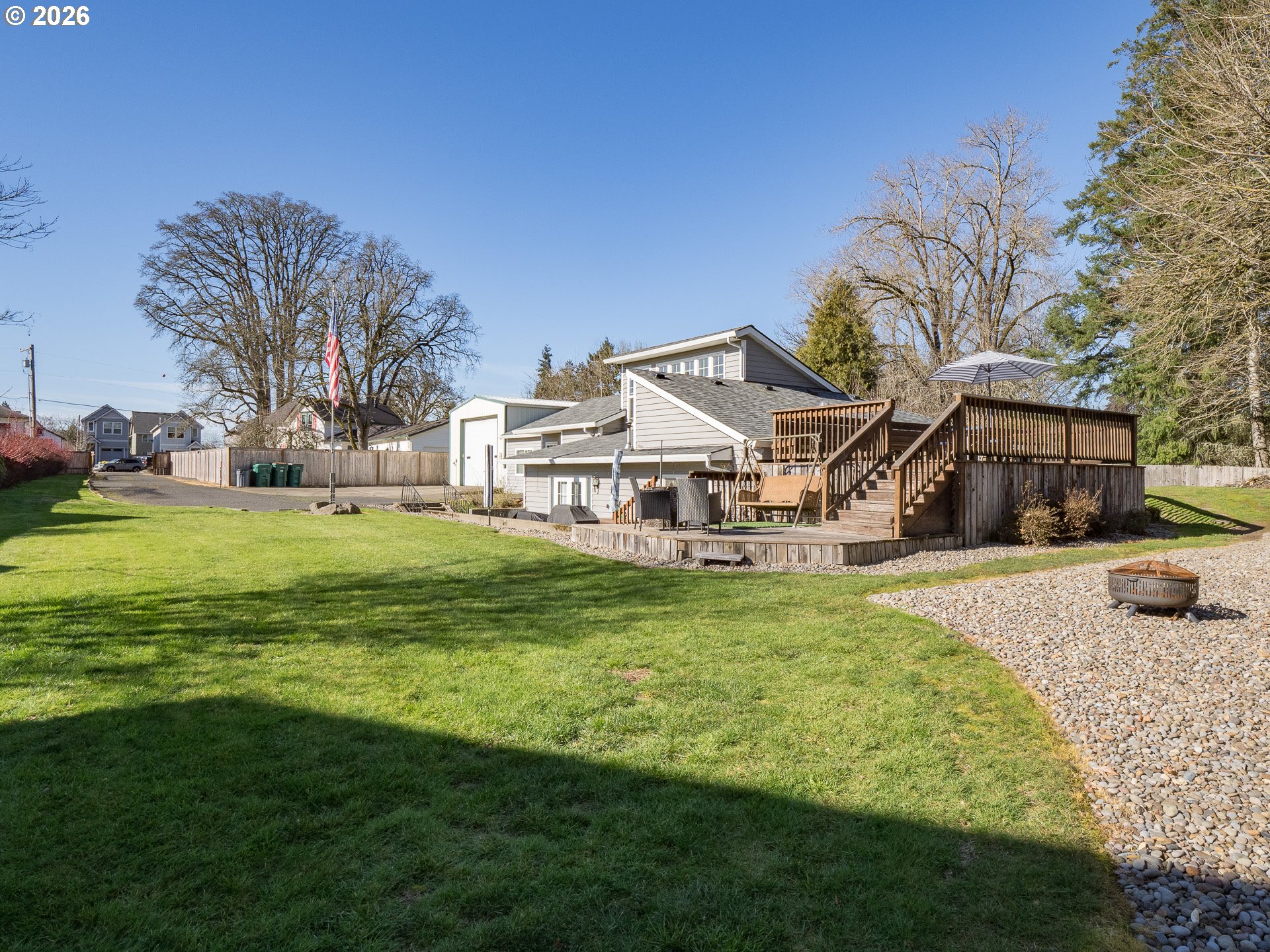 600 Wynooski Street Newberg, OR 97132 - Photo 28 of 48 a white house with a big yard and large trees