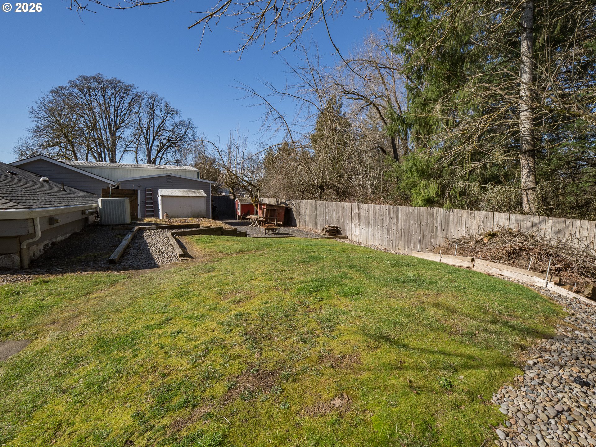 600 Wynooski Street Newberg, OR 97132 - Photo 34 of 48 a view of a patio with table and chairs and wooden fence