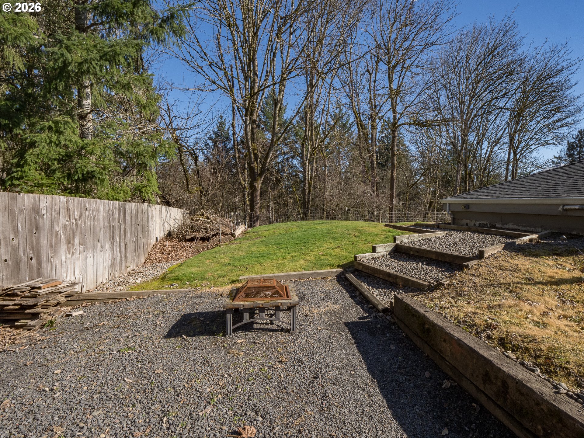 600 Wynooski Street Newberg, OR 97132 - Photo 39 of 48 a view of a backyard with wooden fence