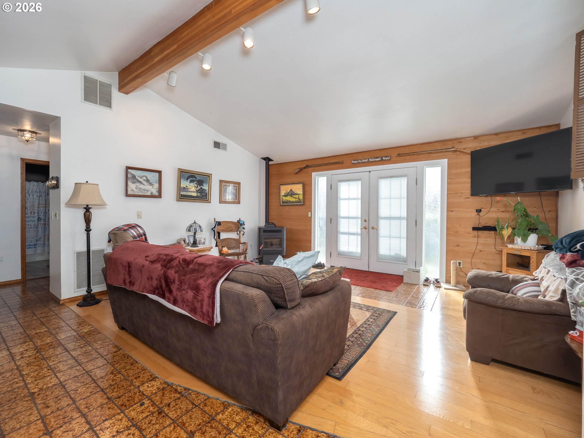600 Wynooski Street Newberg, OR 97132 - Photo 41 of 48 a spacious bedroom with a bed couch and a large window