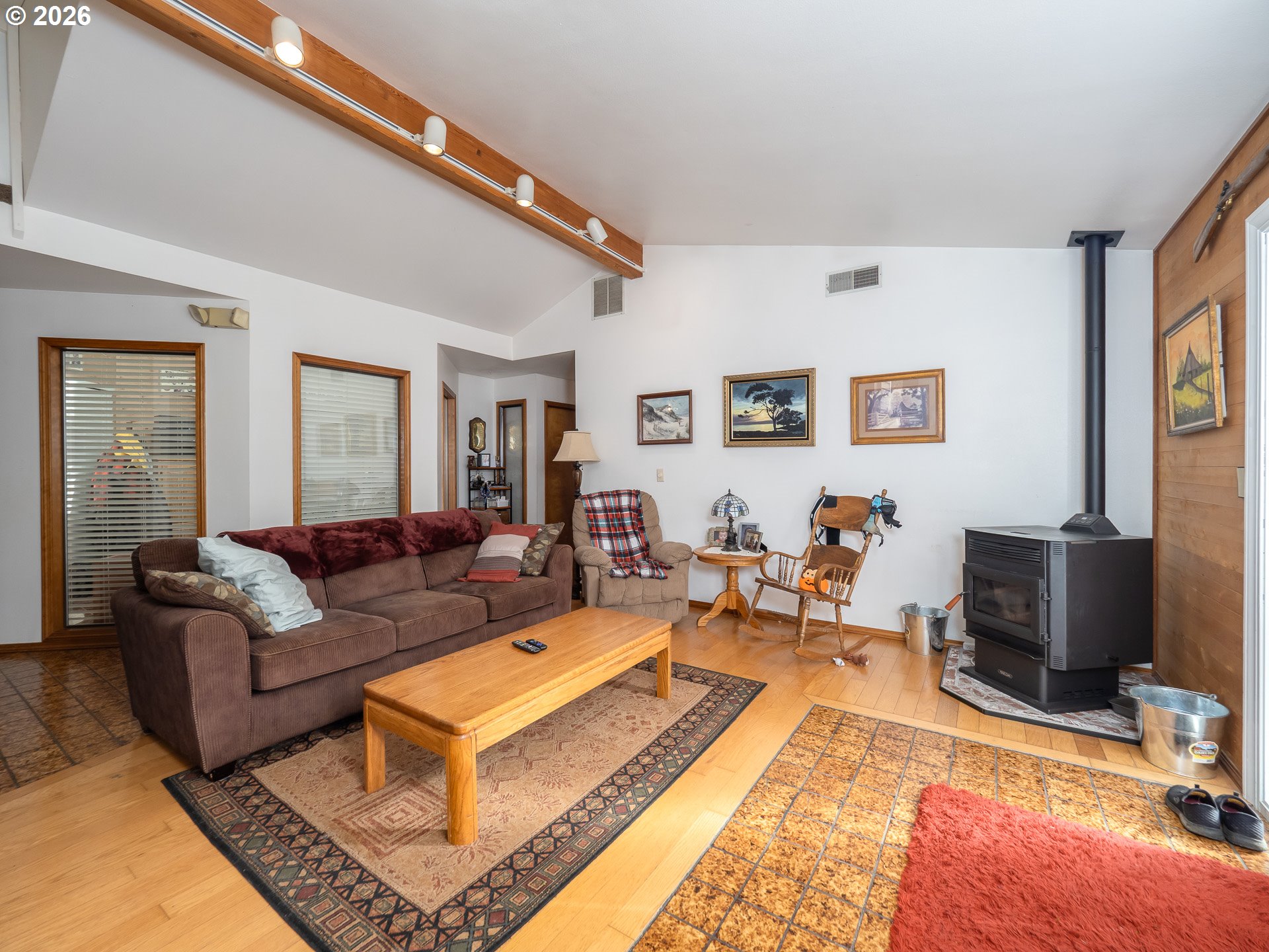 600 Wynooski Street Newberg, OR 97132 - Photo 42 of 48 a living room with furniture a rug and a flat screen tv