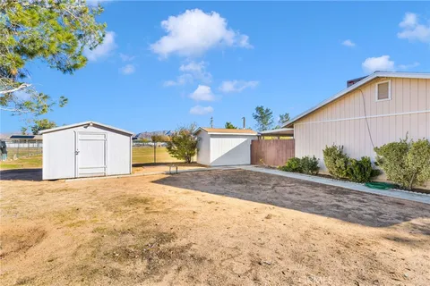 a view of garage with a house